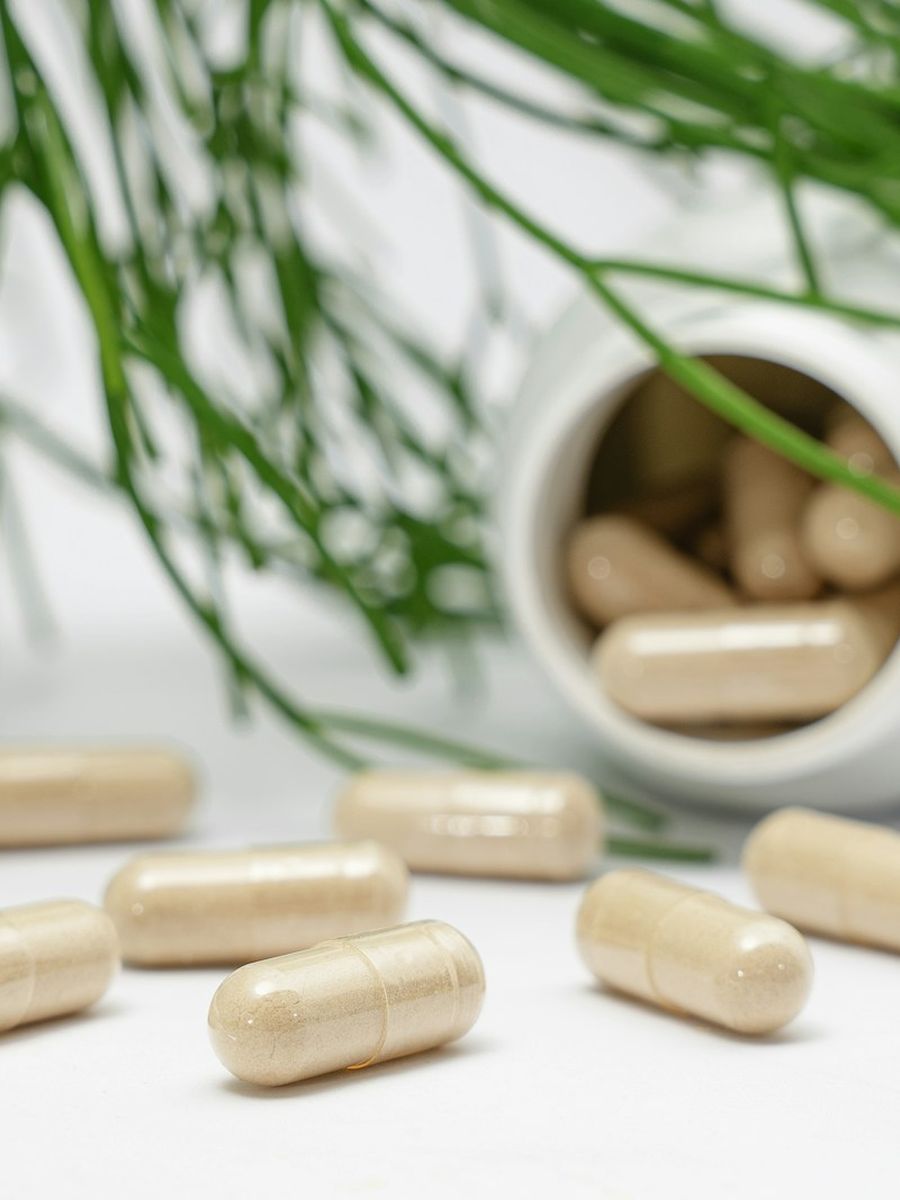 Supplement capsules and bottle